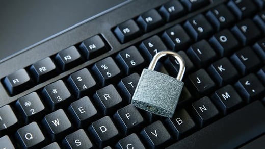 683f2f0e47a55dd9ea9b35d2-highangleshotlockblackcomputerkeyboardblacksurface[1]